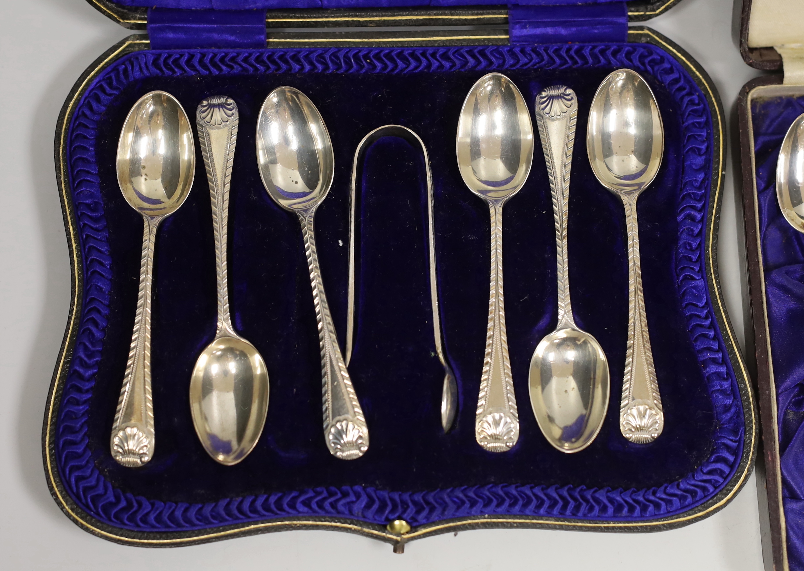 Three assorted cased sets of six silver tea or coffee spoons, one with tongs and other incomplete set.